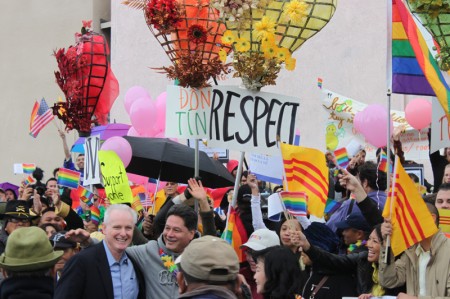 Assemblyman Tom Daly (light-blue shirt) takes a moment away from participating in the 2013 Tet Parade to recognize demonstrators in solidarity with the Partnership of Vietnamese LGBT Organizations. To the right of Daly is Democratic Party of Orange County Chairman Henry Vandermeir. (Photo: Chris Prevatt)